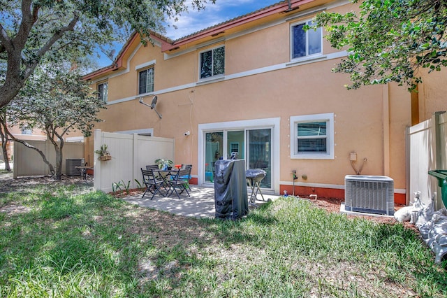 8730 SW 21st St, Miramar, FL 33025 - rear view of property with stucco siding and a patio area