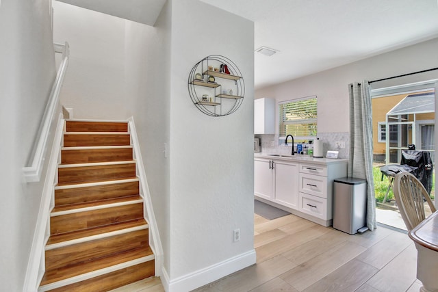 8730 SW 21st St, Miramar, FL 33025 - stairway with wood finished floors and baseboards