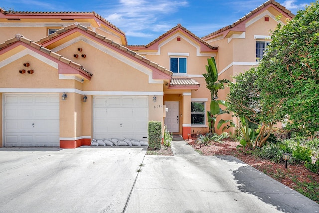 8730 SW 21st St, Miramar, FL 33025 - multi unit property with a tile roof, stucco siding, a garage, and driveway