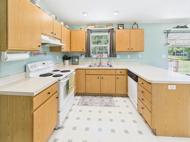 7281 NW 90th Ct, Okeechobee, FL 34972 - kitchen with white appliances, under cabinet range hood, a peninsula, light countertops, and light brown cabinets