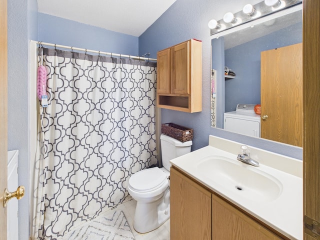 7281 NW 90th Ct, Okeechobee, FL 34972 - bathroom featuring washer / clothes dryer, vanity, a textured wall, and tile patterned floors