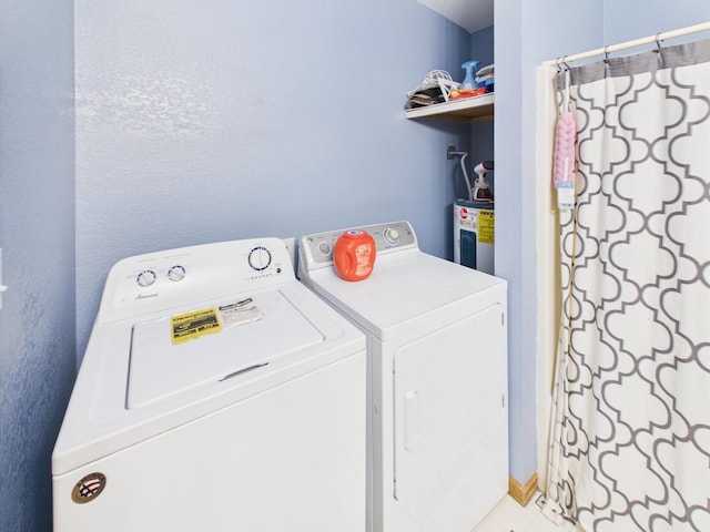 7281 NW 90th Ct, Okeechobee, FL 34972 - laundry area with washing machine and clothes dryer and water heater