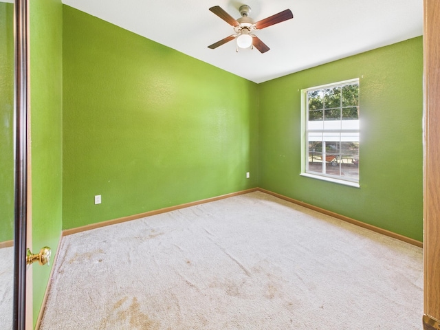 7281 NW 90th Ct, Okeechobee, FL 34972 - empty room with ceiling fan and carpet flooring