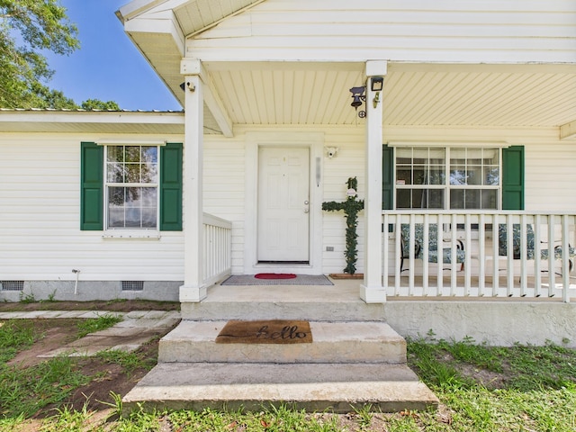 7281 NW 90th Ct, Okeechobee, FL 34972 - doorway to property with a porch and crawl space