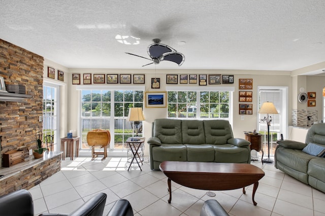 11814 N Lake Dr, Boynton Beach, FL 33436 - living area with ceiling fan, a textured ceiling, and light tile patterned floors