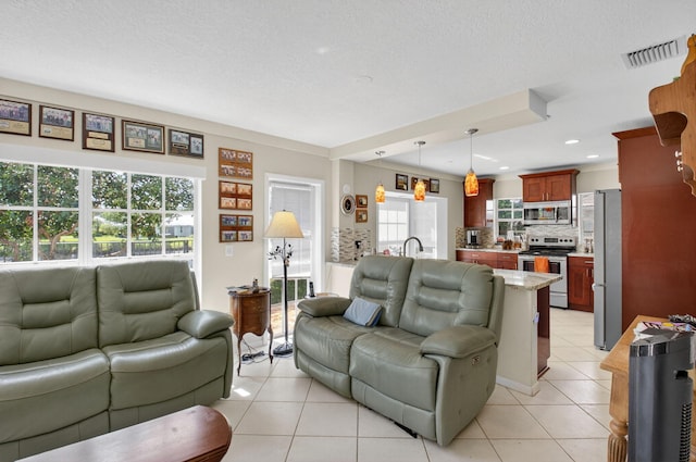11814 N Lake Dr, Boynton Beach, FL 33436 - living room with light tile patterned floors and recessed lighting