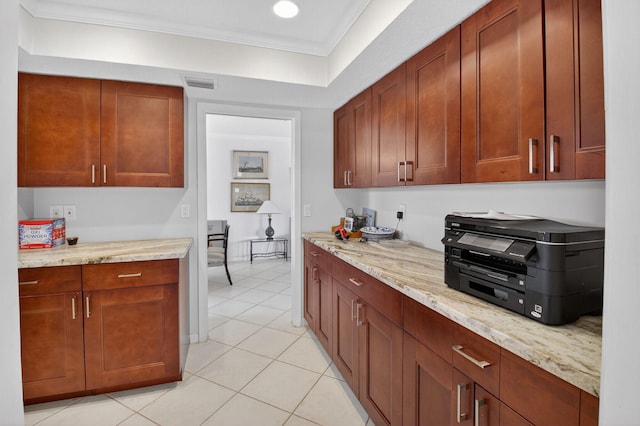 11814 N Lake Dr, Boynton Beach, FL 33436 - kitchen with ornamental molding, light tile patterned floors, and light stone counters