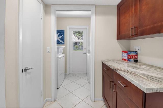 11814 N Lake Dr, Boynton Beach, FL 33436 - washroom with washing machine and clothes dryer and light tile patterned floors