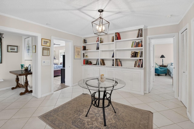11814 N Lake Dr, Boynton Beach, FL 33436 - dining space with ornamental molding, a textured ceiling, and light tile patterned floors
