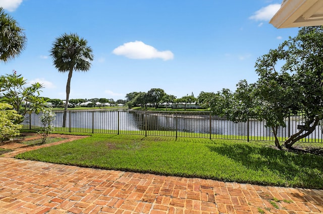 11814 N Lake Dr, Boynton Beach, FL 33436 - fenced backyard featuring a water view and a patio