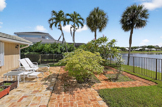 11814 N Lake Dr, Boynton Beach, FL 33436 - fenced backyard featuring a water view and a patio