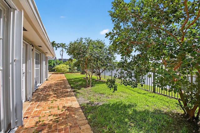 11814 N Lake Dr, Boynton Beach, FL 33436 - fenced backyard with a patio
