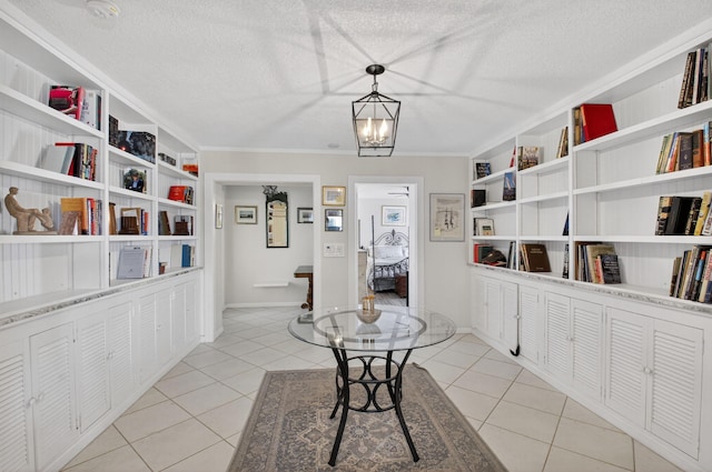 11814 N Lake Dr, Boynton Beach, FL 33436 - hallway featuring light tile patterned floors, a textured ceiling, built in features, and ornamental molding