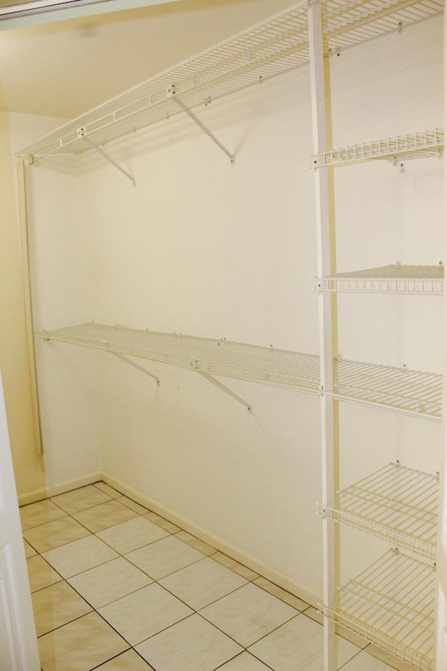 4660 Finchwood Ter Unit B, Boynton Beach, FL 33436 - walk in closet with light tile patterned floors
