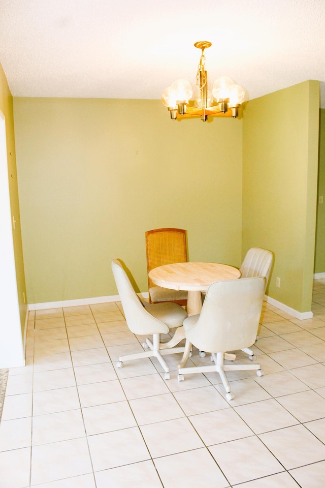 4660 Finchwood Ter Unit B, Boynton Beach, FL 33436 - dining area with a chandelier and light tile patterned floors