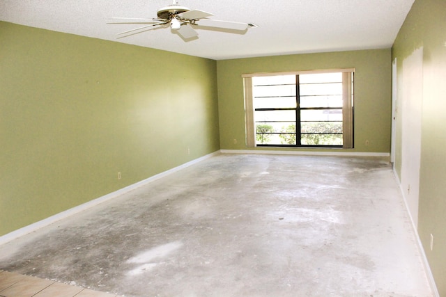4660 Finchwood Ter Unit B, Boynton Beach, FL 33436 - spare room featuring unfinished concrete flooring and ceiling fan