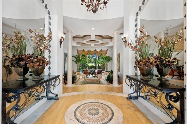 8571 Egret Lakes Ln, West Palm Beach, FL 33412 - entryway with wood finished floors, a chandelier, decorative columns, and coffered ceiling