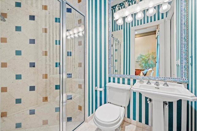 8571 Egret Lakes Ln, West Palm Beach, FL 33412 - bathroom with wallpapered walls and a shower stall