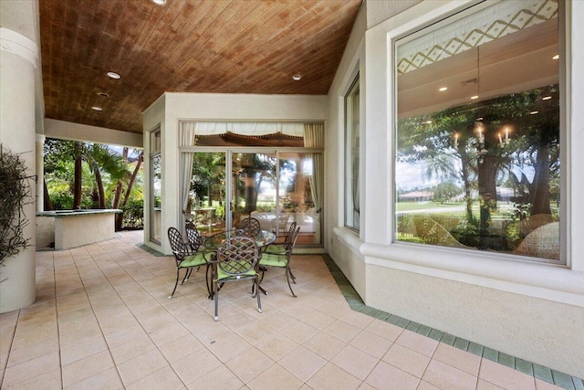 8571 Egret Lakes Ln, West Palm Beach, FL 33412 - sunroom / solarium featuring wood ceiling, tile patterned floors, and recessed lighting