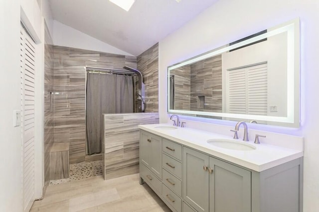 10 Hampton Ct, Palm Beach Gardens, FL 33418 - full bath featuring lofted ceiling, double vanity, and a tile shower