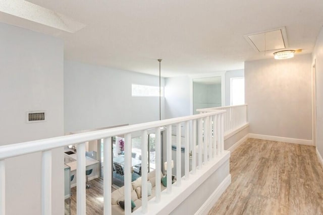 10 Hampton Ct, Palm Beach Gardens, FL 33418 - hallway featuring attic access and wood finished floors