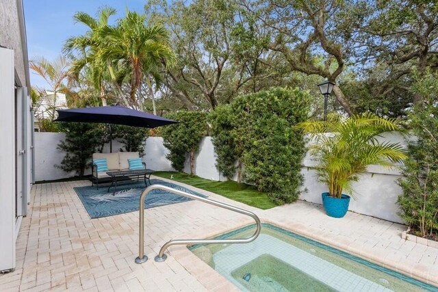 10 Hampton Ct, Palm Beach Gardens, FL 33418 - view of swimming pool with a patio area and a fenced backyard