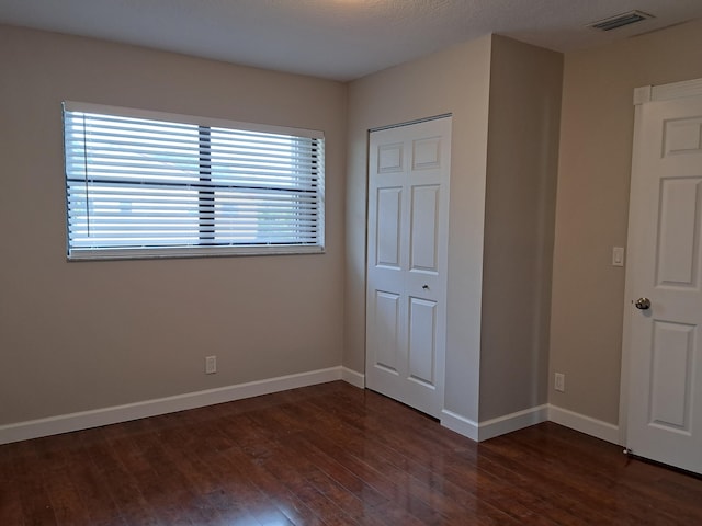 22415 SW 61st Way Unit 204, Boca Raton, FL 33428 - unfurnished bedroom with dark wood-style floors and baseboards