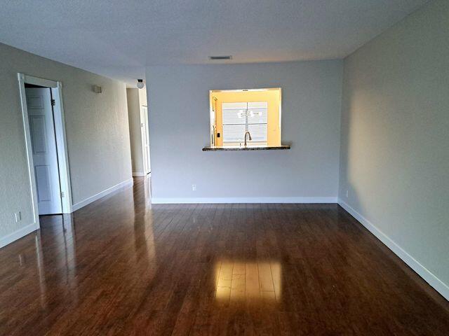 22415 SW 61st Way Unit 204, Boca Raton, FL 33428 - spare room with wood finished floors and baseboards