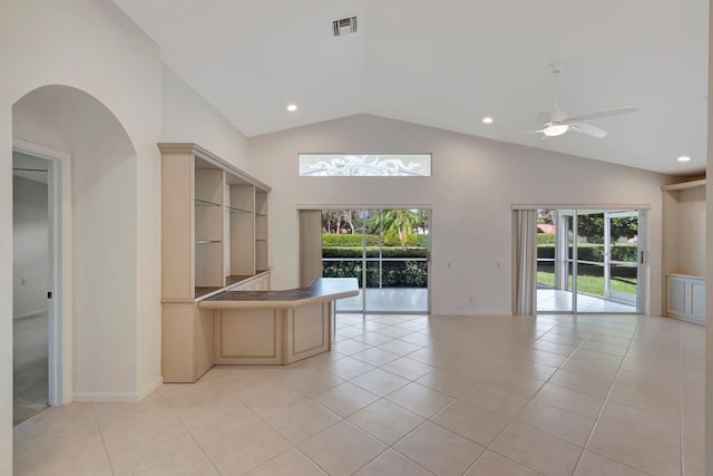 6661 Sherbrook Dr, Boynton Beach, FL 33437 - empty room featuring a ceiling fan, high vaulted ceiling, light tile patterned floors, arched walkways, and recessed lighting