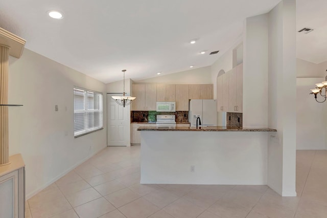 6661 Sherbrook Dr, Boynton Beach, FL 33437 - kitchen with white appliances, a chandelier, decorative backsplash, dark stone countertops, and lofted ceiling