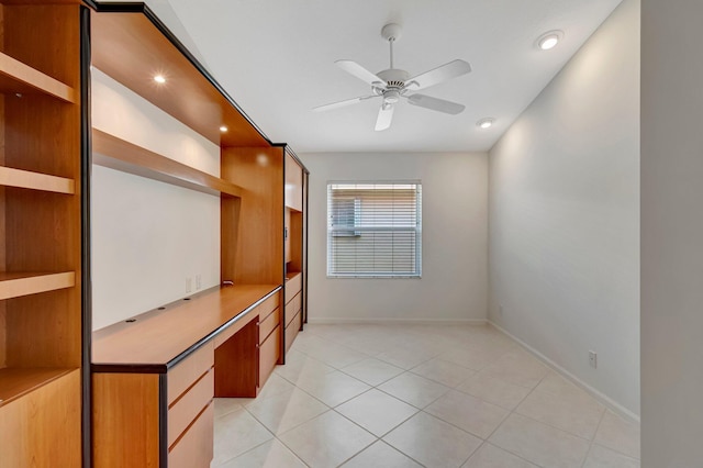 6661 Sherbrook Dr, Boynton Beach, FL 33437 - unfurnished bedroom featuring built in study area, light tile patterned flooring, and recessed lighting