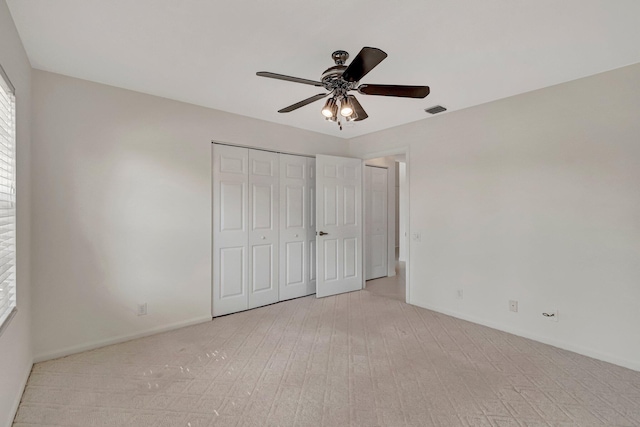 6661 Sherbrook Dr, Boynton Beach, FL 33437 - unfurnished bedroom featuring carpet flooring, a closet, and a ceiling fan