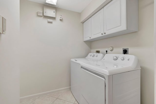 6661 Sherbrook Dr, Boynton Beach, FL 33437 - laundry area featuring cabinet space, washer and dryer, and light tile patterned flooring