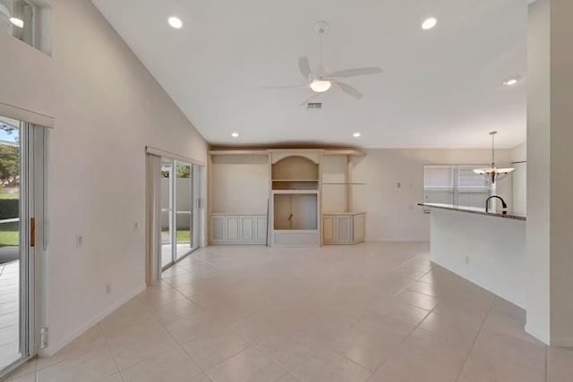6661 Sherbrook Dr, Boynton Beach, FL 33437 - unfurnished living room featuring healthy amount of natural light, ceiling fan, light tile patterned floors, a chandelier, and recessed lighting