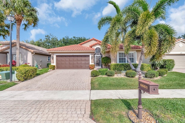 6661 Sherbrook Dr, Boynton Beach, FL 33437 - mediterranean / spanish home featuring stucco siding, decorative driveway, a garage, and a tiled roof