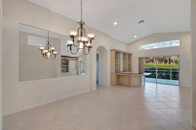 6661 Sherbrook Dr, Boynton Beach, FL 33437 - empty room featuring arched walkways, a chandelier, light tile patterned flooring, high vaulted ceiling, and recessed lighting