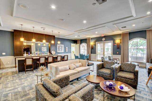 6661 Sherbrook Dr, Boynton Beach, FL 33437 - living area with a decorative wall, wainscoting, recessed lighting, crown molding, and light carpet