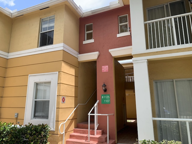 1125 Shoma Dr, Royal Palm Beach, FL 33414 - view of exterior entry featuring stucco siding