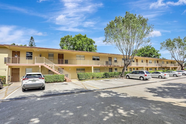 461 NW 76th Ave Unit 205, Margate, FL 33063 - view of property featuring uncovered parking and stairway