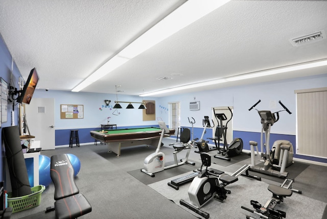 461 NW 76th Ave Unit 205, Margate, FL 33063 - workout area with a textured ceiling, an AC wall unit, and billiards