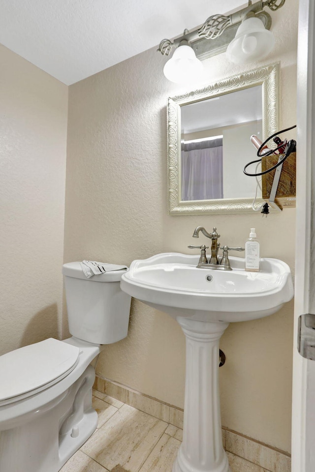 461 NW 76th Ave Unit 205, Margate, FL 33063 - bathroom with toilet and a textured wall