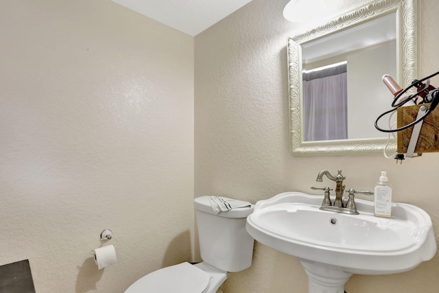 461 NW 76th Ave Unit 205, Margate, FL 33063 - bathroom with a textured wall and curtained shower