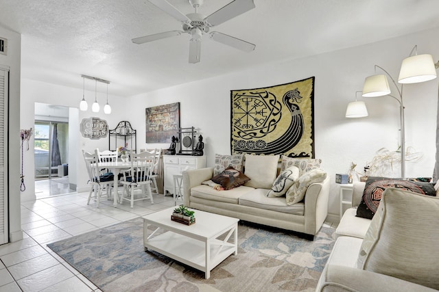 461 NW 76th Ave Unit 205, Margate, FL 33063 - tiled living room featuring ceiling fan and a textured ceiling