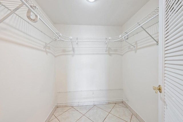 1036 US Highway 1 Unit 318, North Palm Beach, FL 33408 - spacious closet with light tile patterned floors