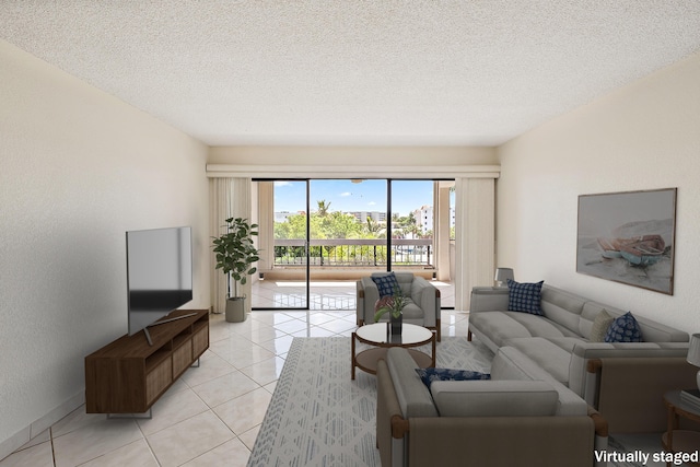 1036 US Highway 1 Unit 318, North Palm Beach, FL 33408 - living area featuring light tile patterned floors and a textured ceiling