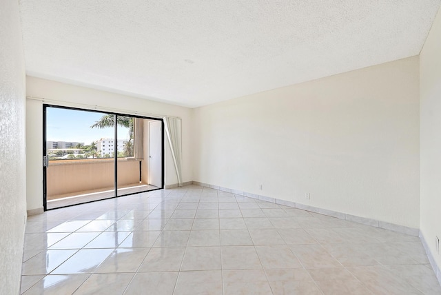 1036 US Highway 1 Unit 318, North Palm Beach, FL 33408 - empty room featuring light tile patterned flooring and a textured ceiling