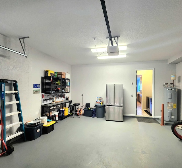 2247 SW Cape Cod Dr, Port Saint Lucie, FL 34953 - garage with water heater, freestanding refrigerator, and a garage door opener