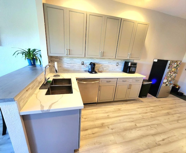 2247 SW Cape Cod Dr, Port Saint Lucie, FL 34953 - kitchen featuring stainless steel appliances, gray cabinetry, and light wood-style floors