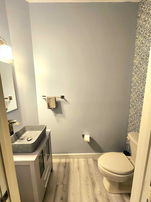 2247 SW Cape Cod Dr, Port Saint Lucie, FL 34953 - bathroom featuring wood finished floors and vanity