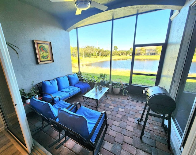 2247 SW Cape Cod Dr, Port Saint Lucie, FL 34953 - sunroom / solarium featuring an outdoor hangout area, a water view, a ceiling fan, and plenty of natural light